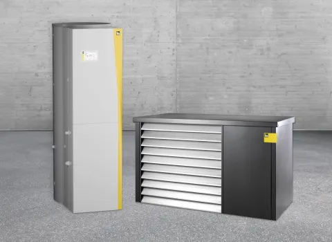 Innen- und Außeneinheit der Wärmepumpe iPUMP A8 ONE von iDM vor einer puristischen, grauen Wand.